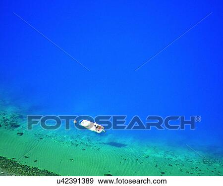 Stock Photo - outdoors, tropical, shore, water, sea, boat. Fotosearch