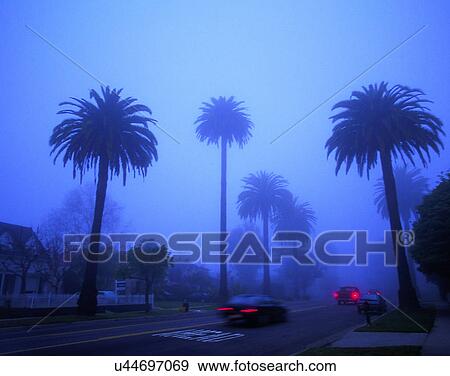 Stock Photo - outdoors, tropical, sky, rain, residential, houses. Fotosearch