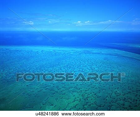 Stock Photograph - outdoors, tropical, sky, water, sea, clouds. Fotosearch