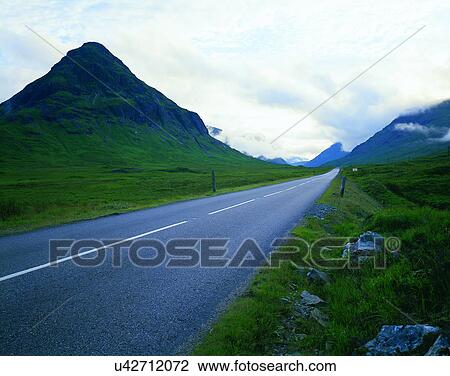 Stock Image - road, outdoor, mountains, grass, landscape, sky. Fotosearch