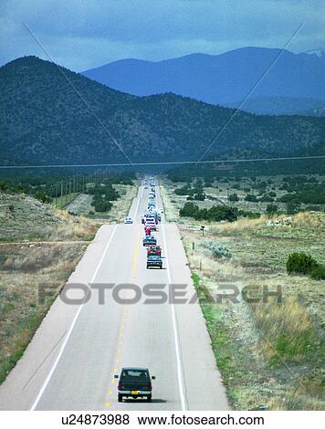 Stock Photo - road, outdoor, sky, light, clouds, cars. Fotosearch