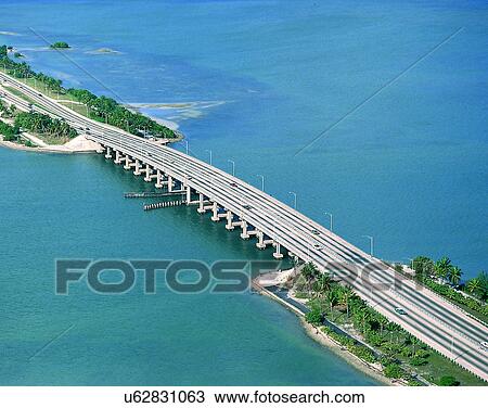 Stock Image - road, outdoor, sky, light, clouds, oceans. Fotosearch