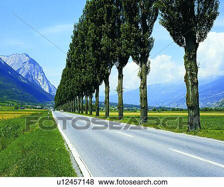 Stock Photo - road, outdoor, sky, light, mountains, clouds. Fotosearch