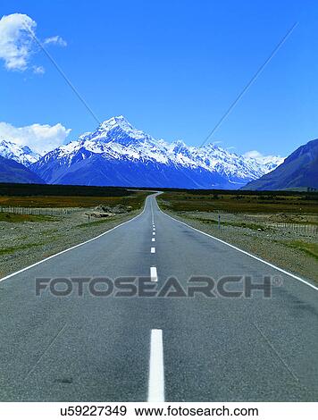 Stock Photo - road, outdoor, sky, light, mountains, clouds. Fotosearch