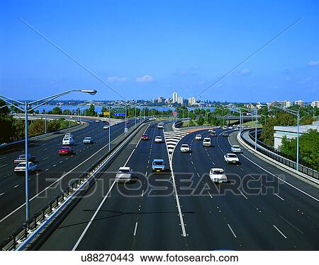 Stock Image - road, outdoor, sky, light, tree, clouds. Fotosearch