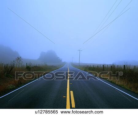 Stock Photography - road, outdoor, sky, wire poles, grass, fog. Fotosearch