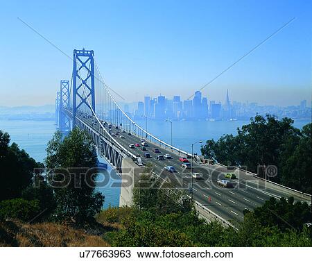 Stock Image - road, outdoor, trees, sky, light, city. Fotosearch