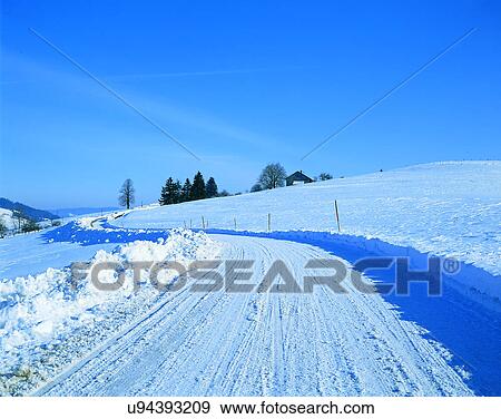 Stock Photo - road, outdoor, trees, sky, snow, house. Fotosearch