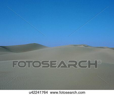 Picture - sand, desert, dry, hills, outdoors, shadows. Fotosearch