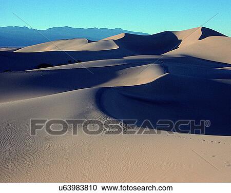 Stock Image - sand, outdoors, desert, dry, hills, mountains. Fotosearch