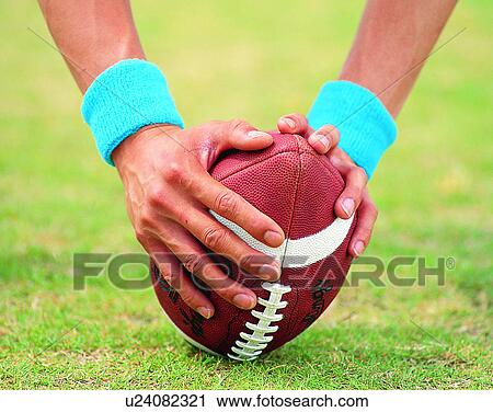 sport, outdoors, close-up, hands, football, grass View Large Photo Image Stock Image - sport, outdoors, close-up, hands, football, grass. Fotosearch