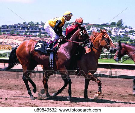 Stock Image - sport, outdoors, horseracing, horses, jockeys, track. Fotosearch