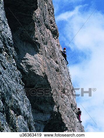 Stock Photo - sport, outdoors, mountain climbing, people, sky, clouds. Fotosearch