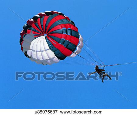 Stock Photo - sport, outdoors, parachute, person, sky. Fotosearch