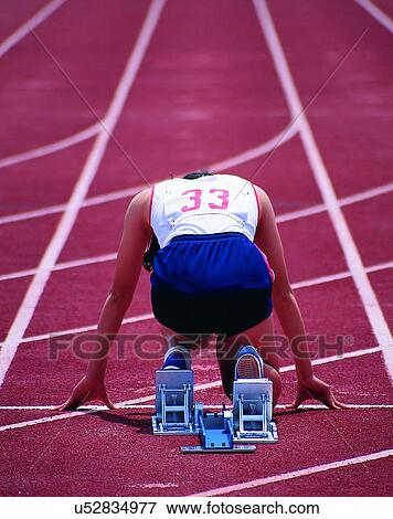 sport, outdoors, runner, racetrack, kneeling, back View Large Photo Image Stock Photo - sport, outdoors, runner, racetrack, kneeling, back. Fotosearch
