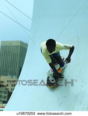Stock Image - sport, outdoors, skateboarding, boy, ramp, building. Fotosearch