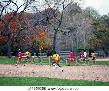 Stock Photo - sport, outdoors, soccer, football, park, field. Fotosearch