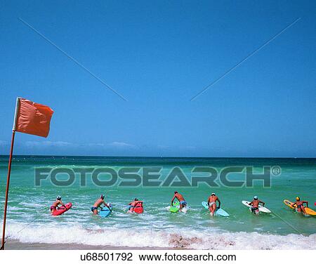 Stock Image - sport, outdoors, water, beach, surfing, people. Fotosearch