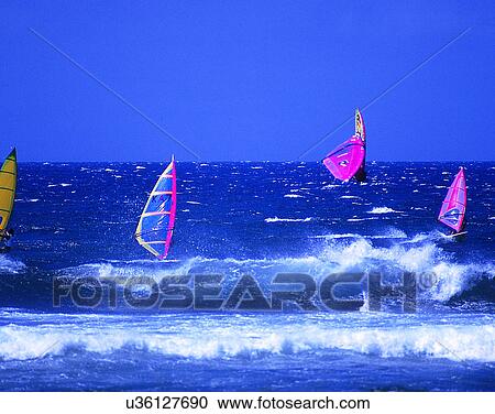 Stock Image - sport, outdoors, water, windsurfing, waves, sky. Fotosearch