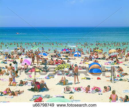 Stock Photo - summer, outdoors, sky, beach, water, people. Fotosearch