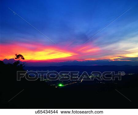 Picture - sun light, sun, sky, clouds, outdoors, sunset. Fotosearch