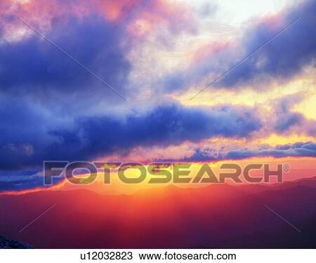Stock Image - sun light, sun, sky, clouds, outdoors, sunset. Fotosearch