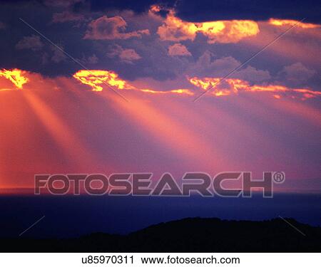 Stock Image - sun light, sun, sky, clouds, outdoors, sunset. Fotosearch