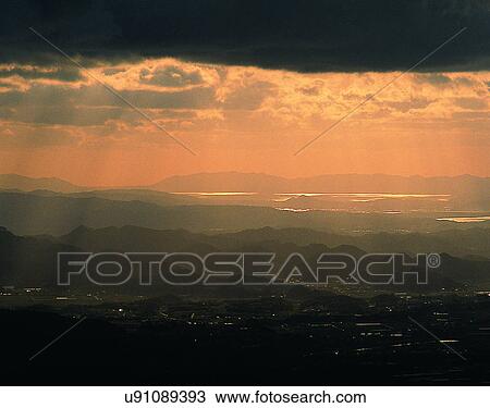 Stock Image - sun light, sun, sky, clouds, outdoors, sunset. Fotosearch