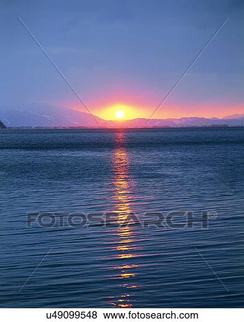 Stock Photo - sun light, sun, sky, clouds, outdoors, dawn. Fotosearch