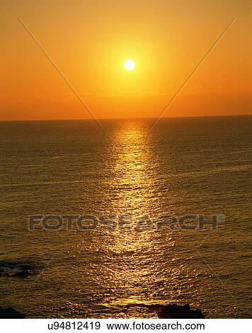 Stock Photo - sun light, sun, sky, clouds, outdoors, sunset. Fotosearch