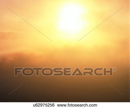 Stock Photograph - sun light, sun, sky, clouds, outdoors, sunset. Fotosearch