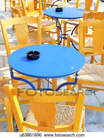 Stock Photograph - tables, outdoors, chairs, café, restaurant, Aegean sea. Fotosearch