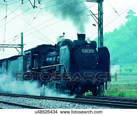 Picture - train, travel, transportation, outdoors, daylight, smoke. Fotosearch