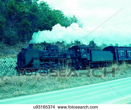 Picture - train, travel, transportation, outdoors, daylight, smoke. Fotosearch
