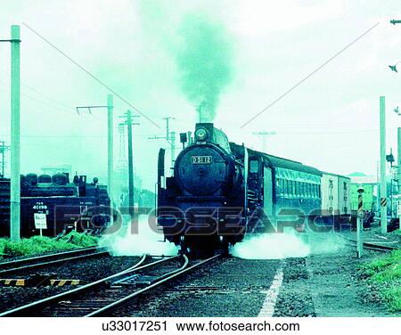 Stock Image - train, travel, transportation, outdoors, daylight, smoke. Fotosearch