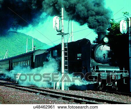 Stock Image - train, travel, transportation, outdoors, daylight, smoke. Fotosearch