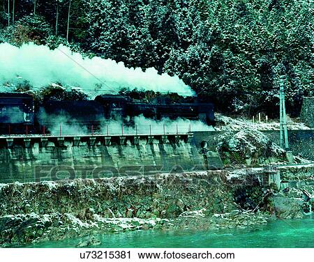 Stock Image - train, travel, transportation, outdoors, daylight, smoke. Fotosearch