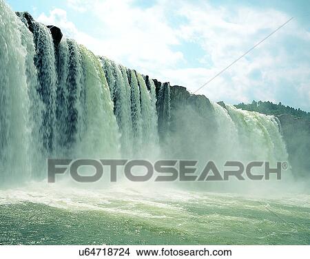 Picture - waterfall, nature, outdoors, rocks, spray, sky. Fotosearch