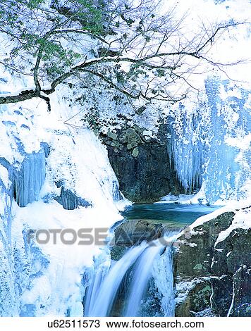 Stock Image - waterfall, nature, outdoors, rocks, winter, snow. Fotosearch