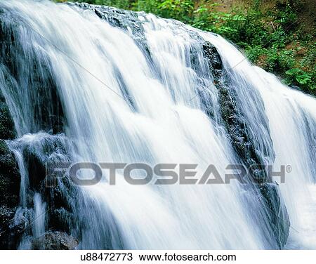 Stock Image - waterfall, nature, outdoors, rocks, plants. Fotosearch