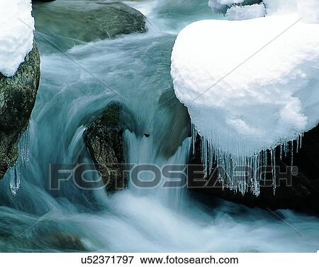 Stock Photo - waterfall, nature, outdoors, rocks, winter, snow. Fotosearch