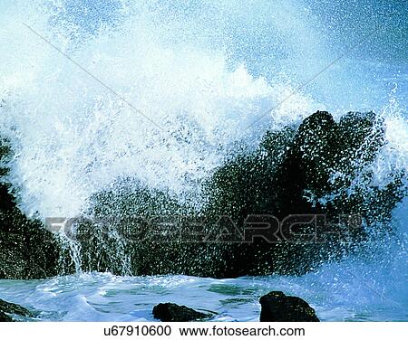 Stock Image - waves, water, outdoors, daylight, spray, rocks. Fotosearch