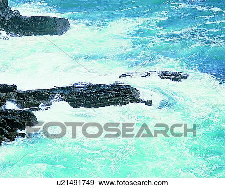 Stock Photo - waves, water, outdoors, daylight, spray, rocks. Fotosearch