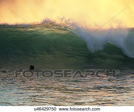 Stock Image - waves, water, outdoors, sunset crest, splash, spray. Fotosearch