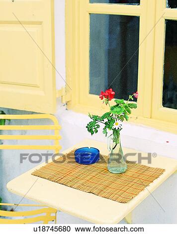 window, outdoors, chairs, table, flower, Aegean sea View Large Photo Image Stock Image - window, outdoors, chairs, table, flower, Aegean sea. Fotosearch