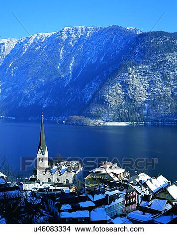 Picture - winter, snow, outdoors, sky, buildings, mountains. Fotosearch