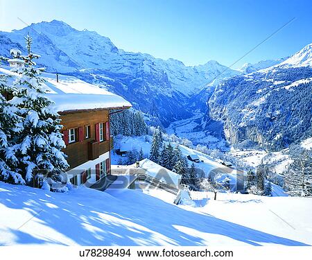 Picture - winter, snow, outdoors, sky, buildings, mountains. Fotosearch