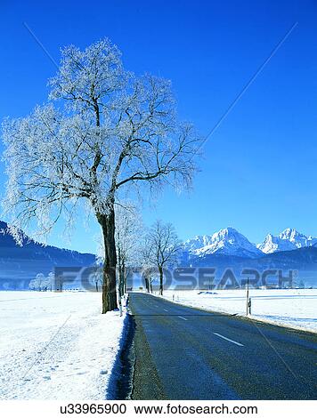 Stock Image - winter, snow, outdoors, sky, buildings, mountains. Fotosearch