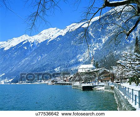 Stock Image - winter, snow, outdoors, sky, buildings, mountains. Fotosearch