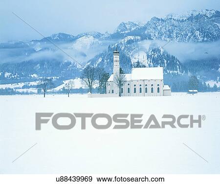 Stock Photo - winter, snow, outdoors, sky, buildings, mountains. Fotosearch